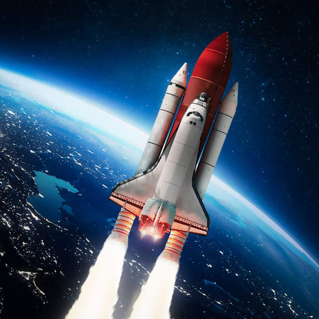 A space shuttle is taking off from the earth
