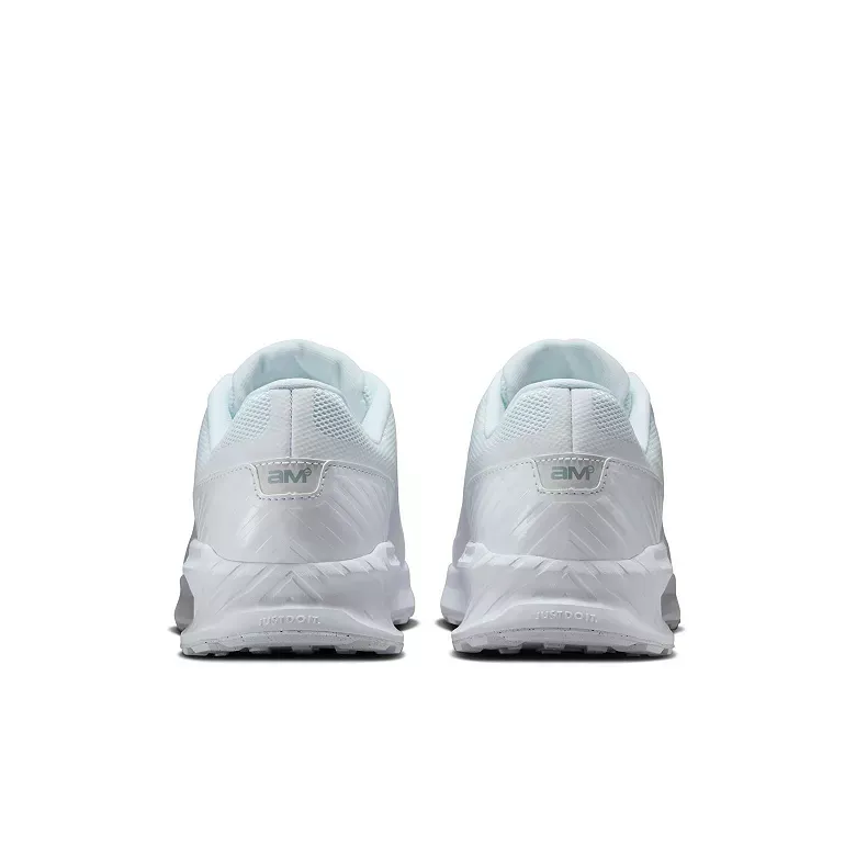 Pair of white Nike Air Max golf shoes with black swooshes.
