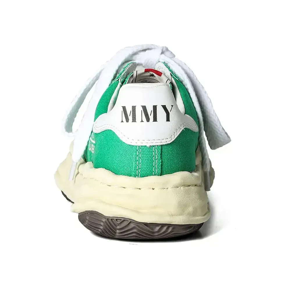 Green and white sneakers with white laces and 