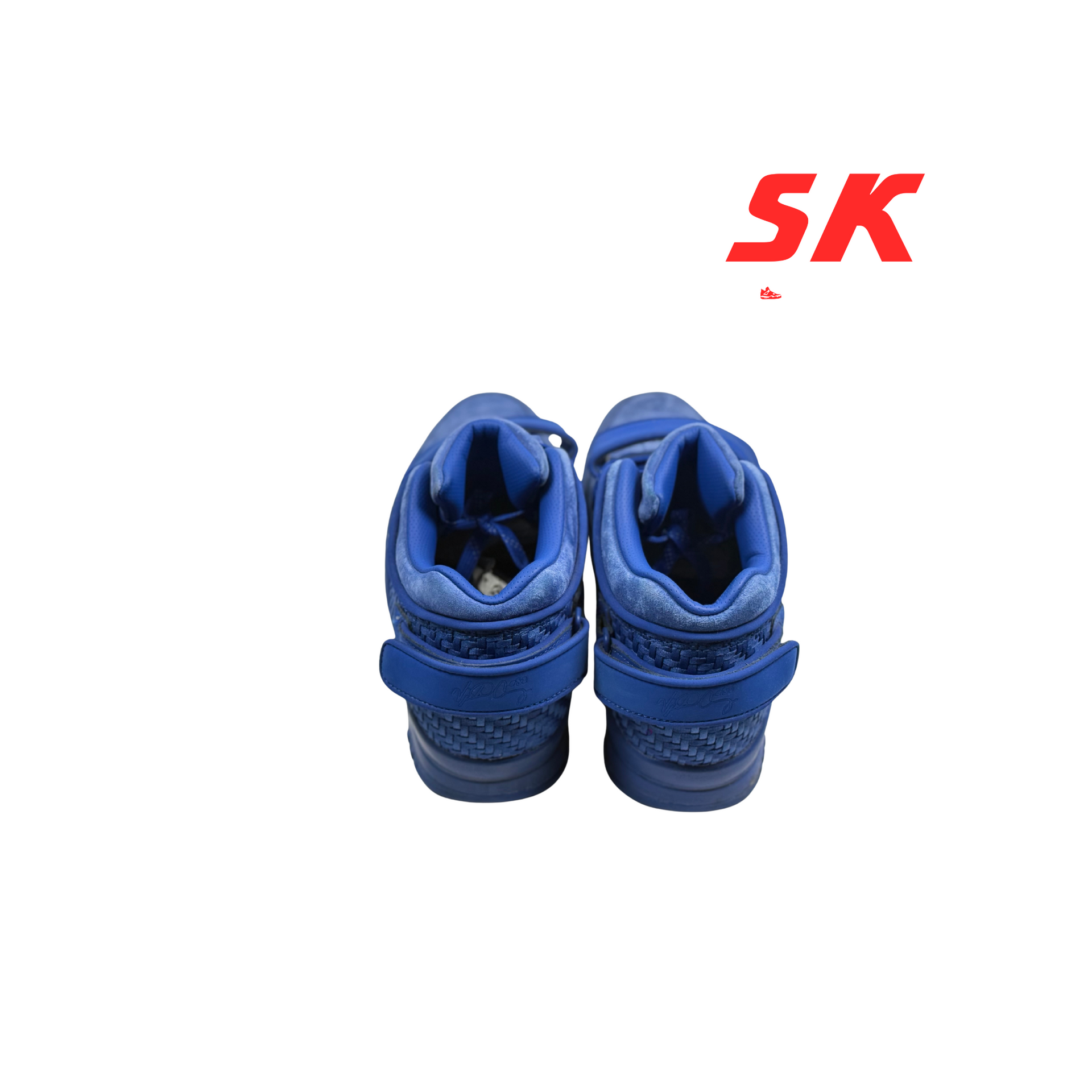 Pair of blue sneakers with strap.