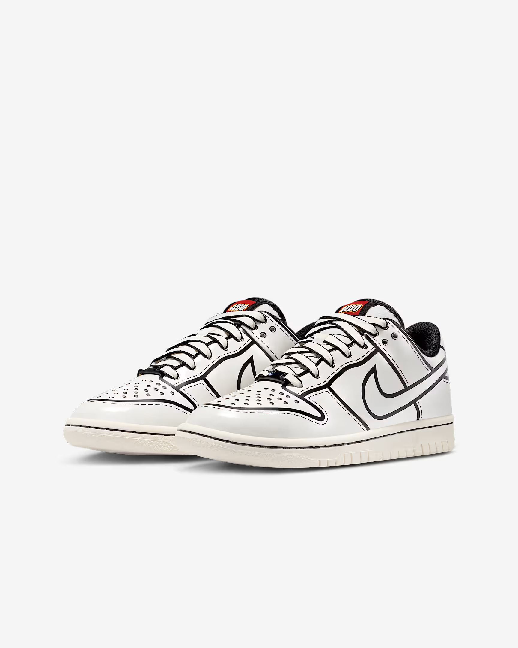White Nike Dunk sneakers with black outline and red accents.
