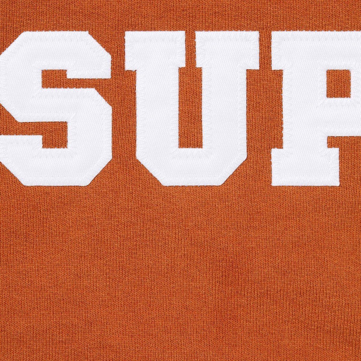 Orange Supreme zip-up hoodie with white