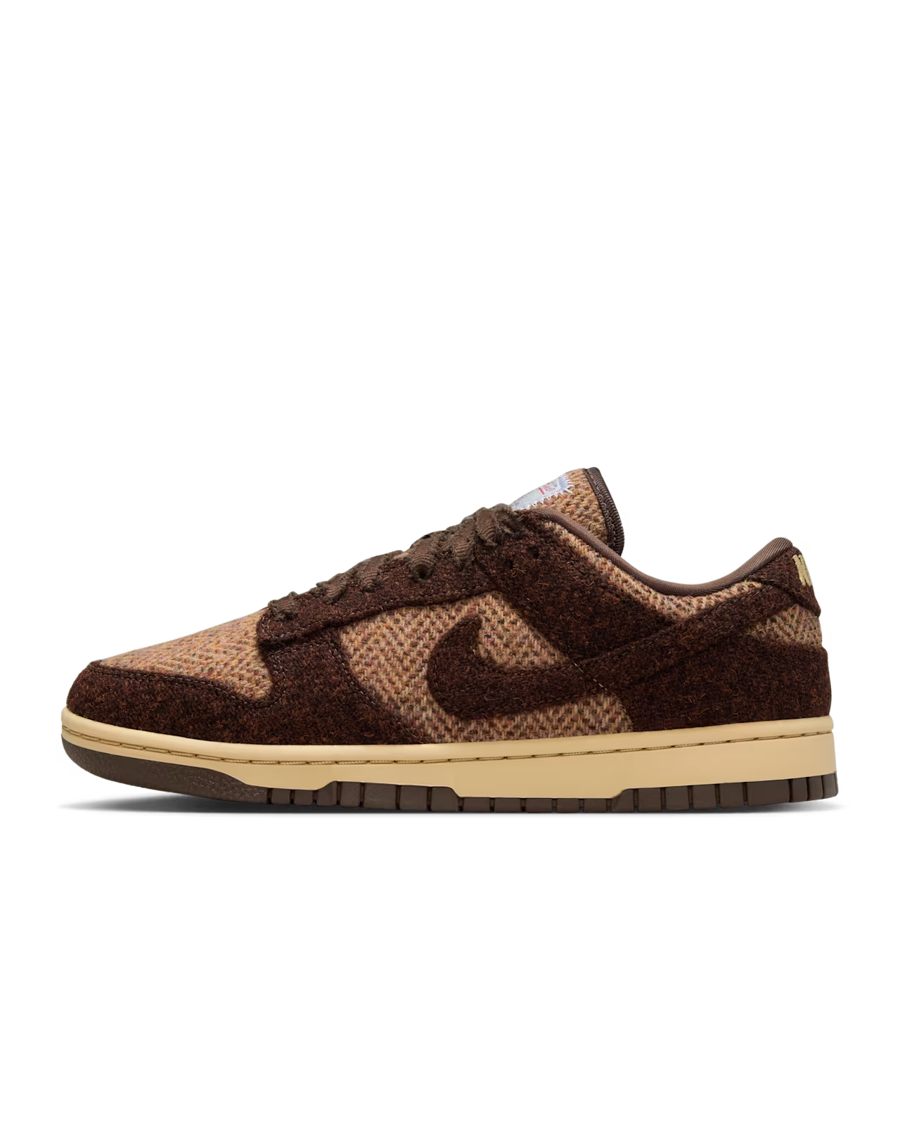 Pair of brown and tan Nike Dunk Low sneakers.