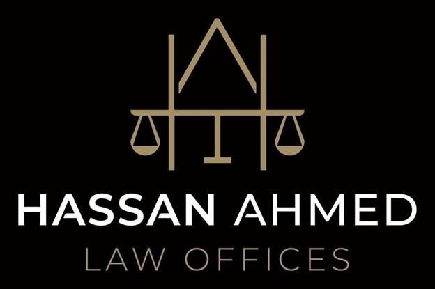 Logo for Hassan Ahmed Law Offices featuring a gold balance scale integrated into the letters H and A on a black background.
