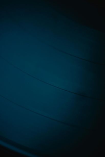 Dark blue abstract gradient with subtle diagonal curved lines