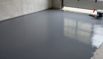 “Finished gray garage epoxy floor with a clean glossy surface by an epoxy flooring contractor in Waterbury, CT”