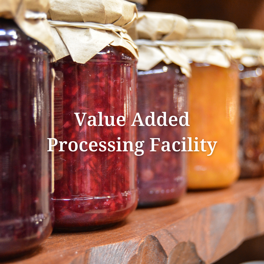 jars of jam on a shelf with the words value added processing facility above them
