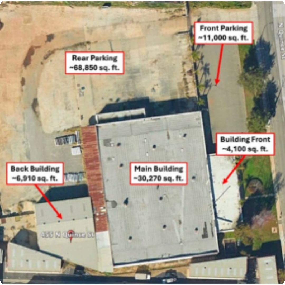 Aerial view of innovation hub property with parking and   buildings