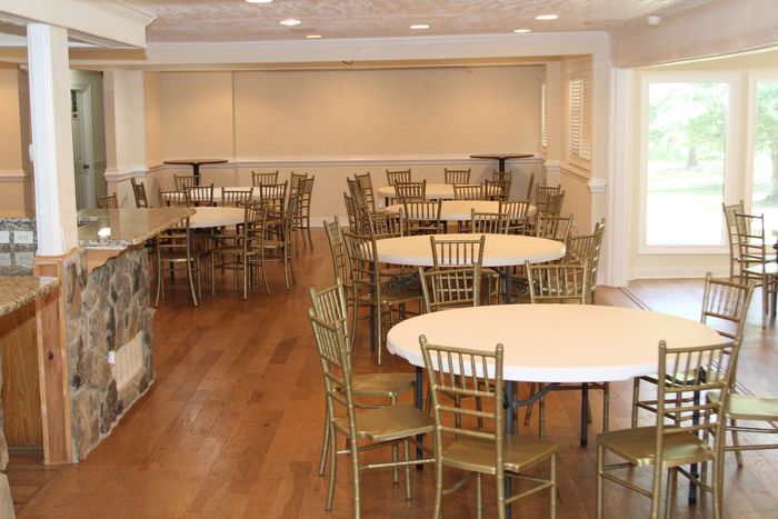 A large room with tables and chairs in it