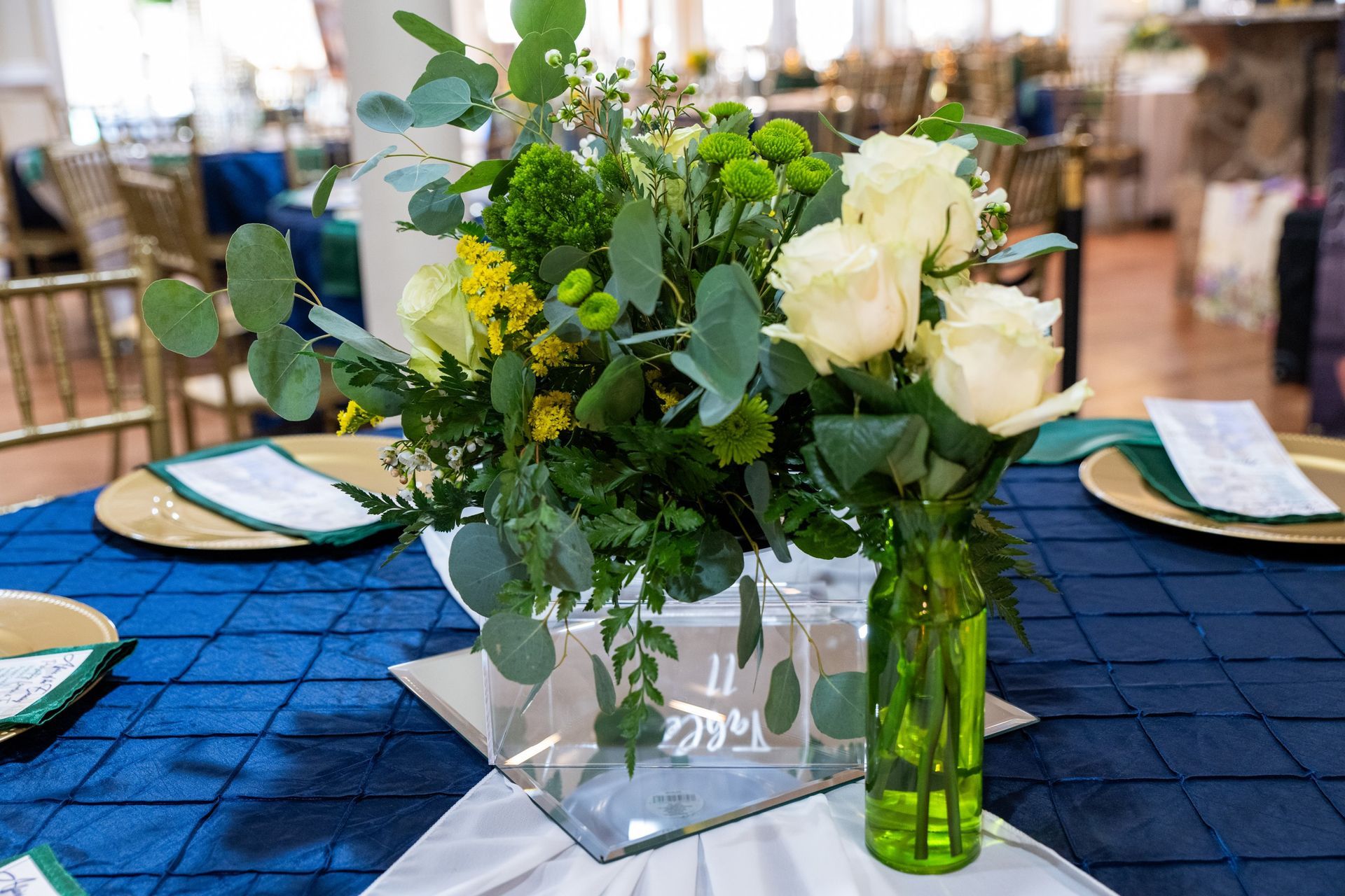 Two vases filled with flowers are sitting on a table.