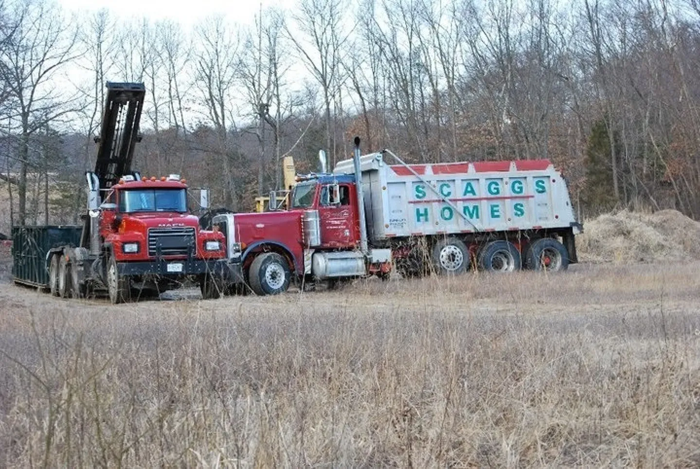A red truck with the word homes on it