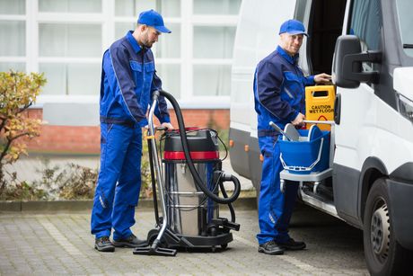 two male janitors in uniform