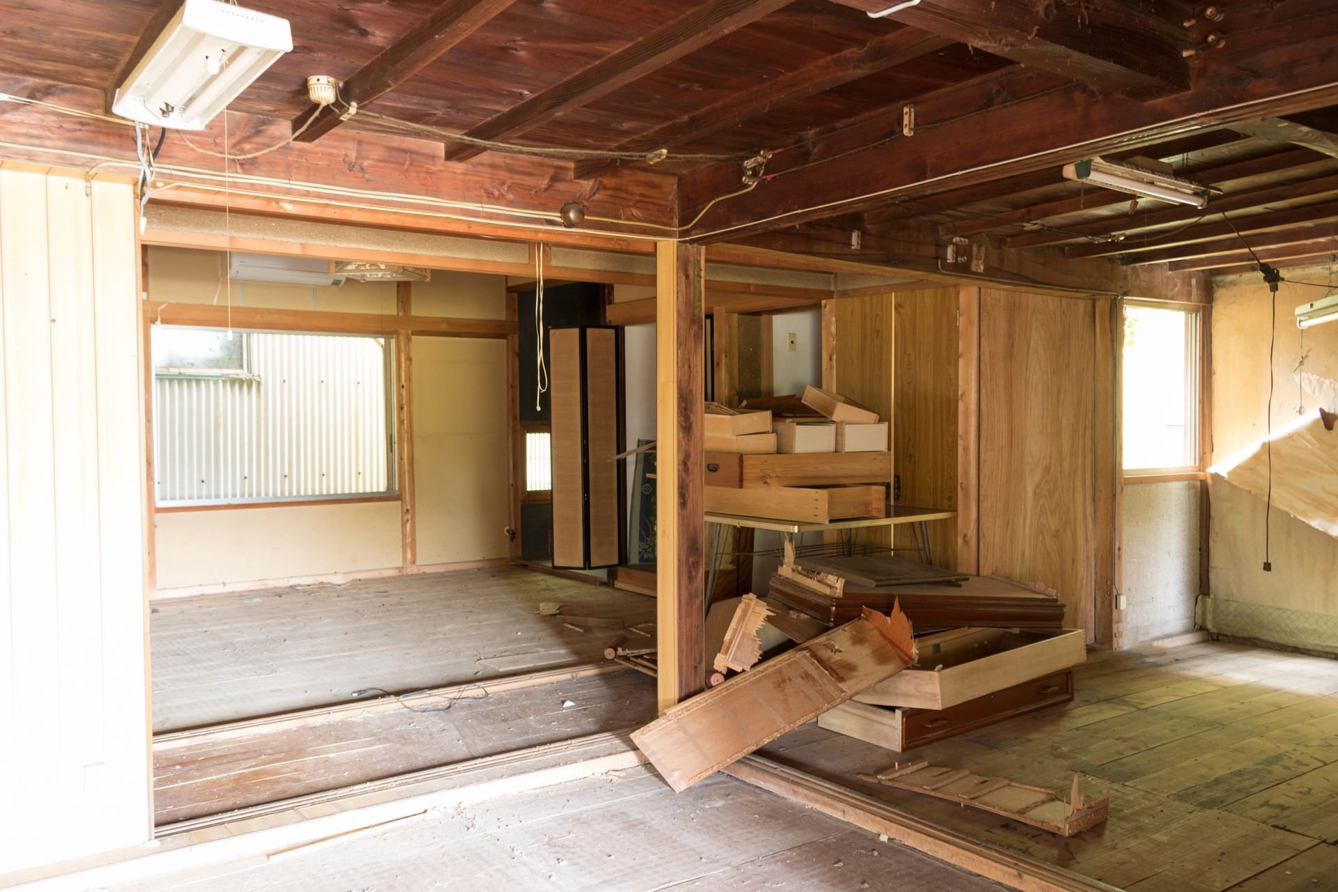 An empty room with wooden walls and a wooden floor.