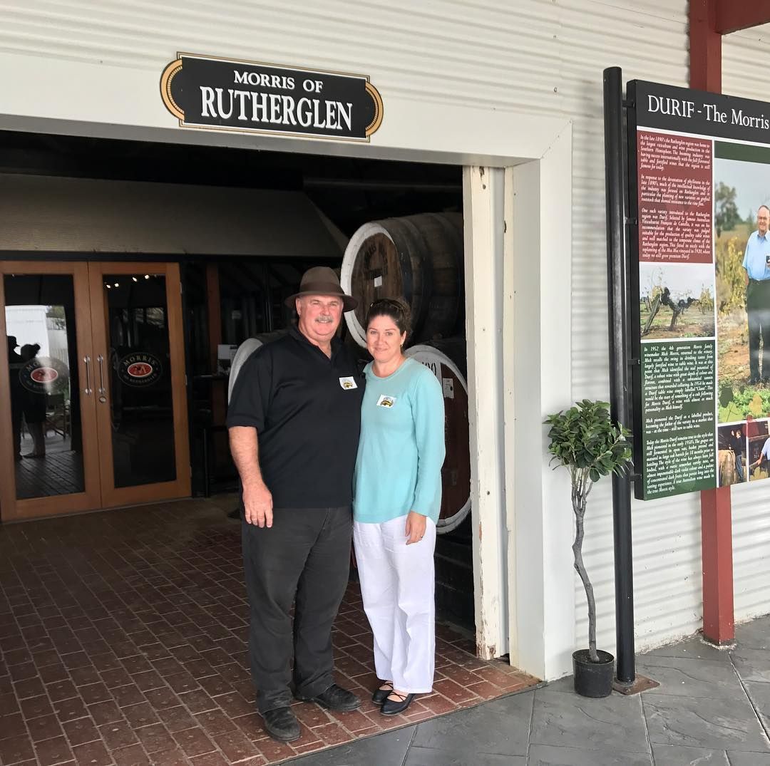 Two people stand in front of the Murray of Rutherglen museum