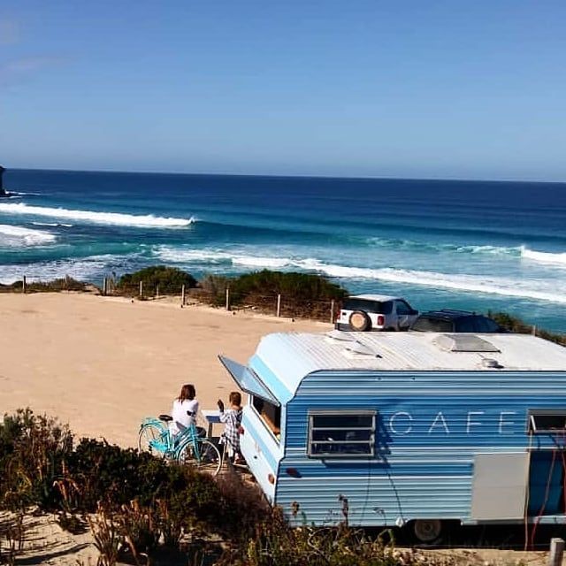 Blue cafe caravan on a beach