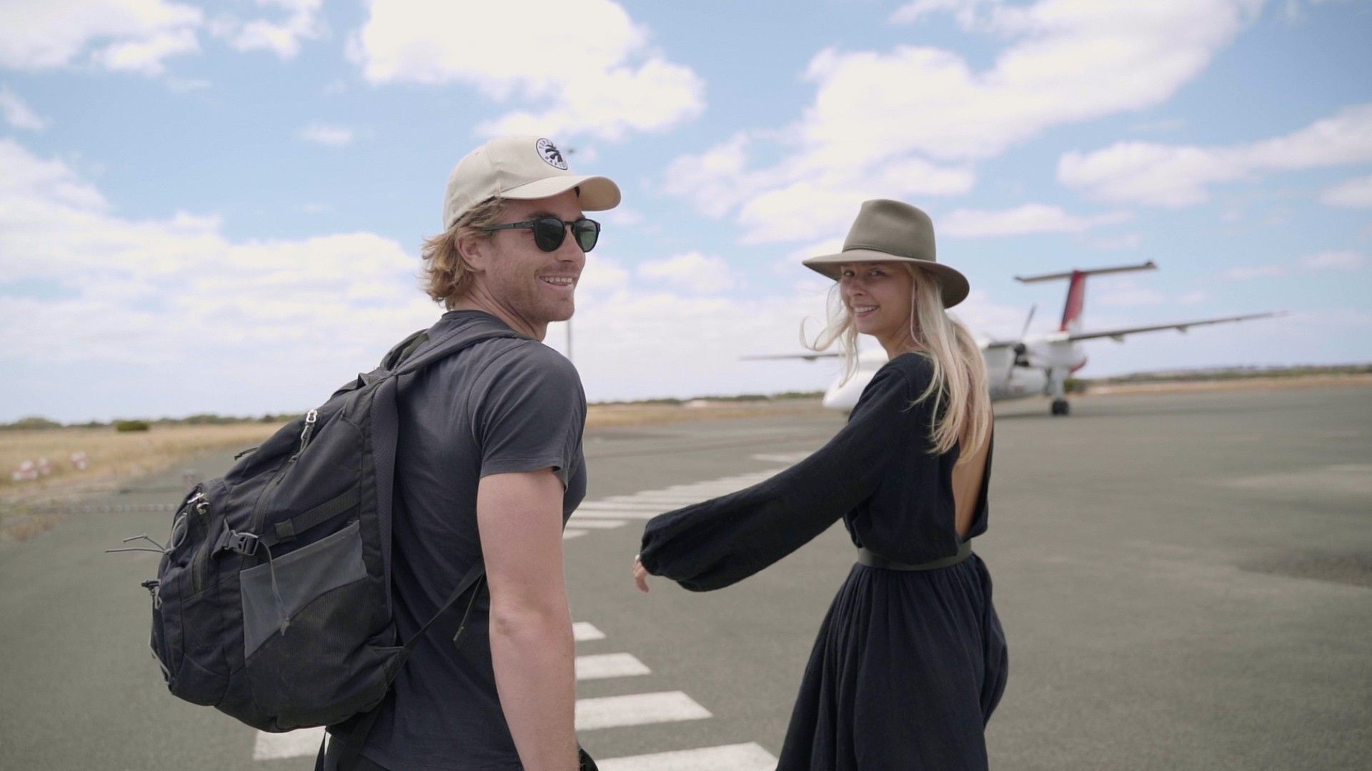 A couple walking while smilling