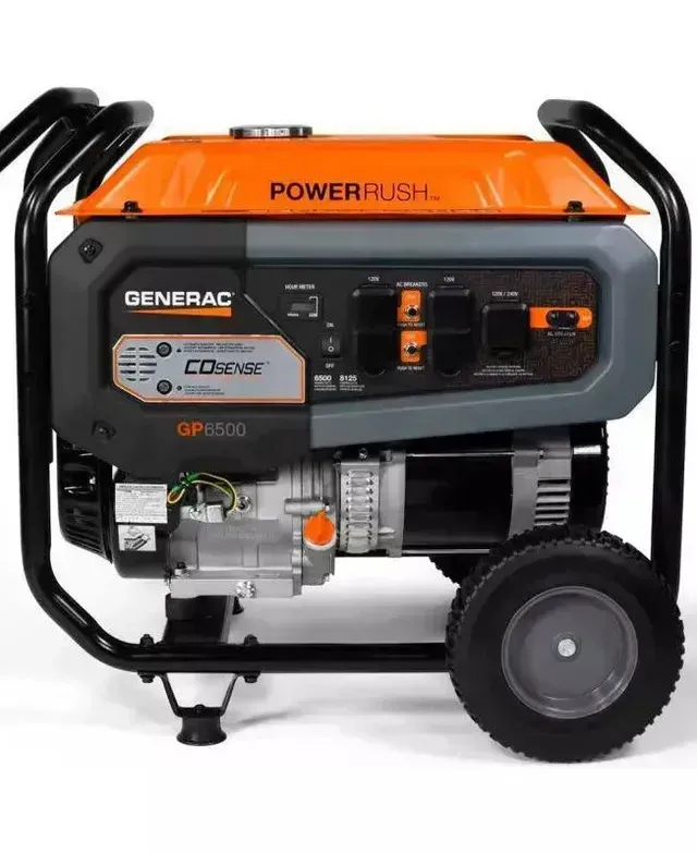 a generator with wheels is sitting on a white surface .