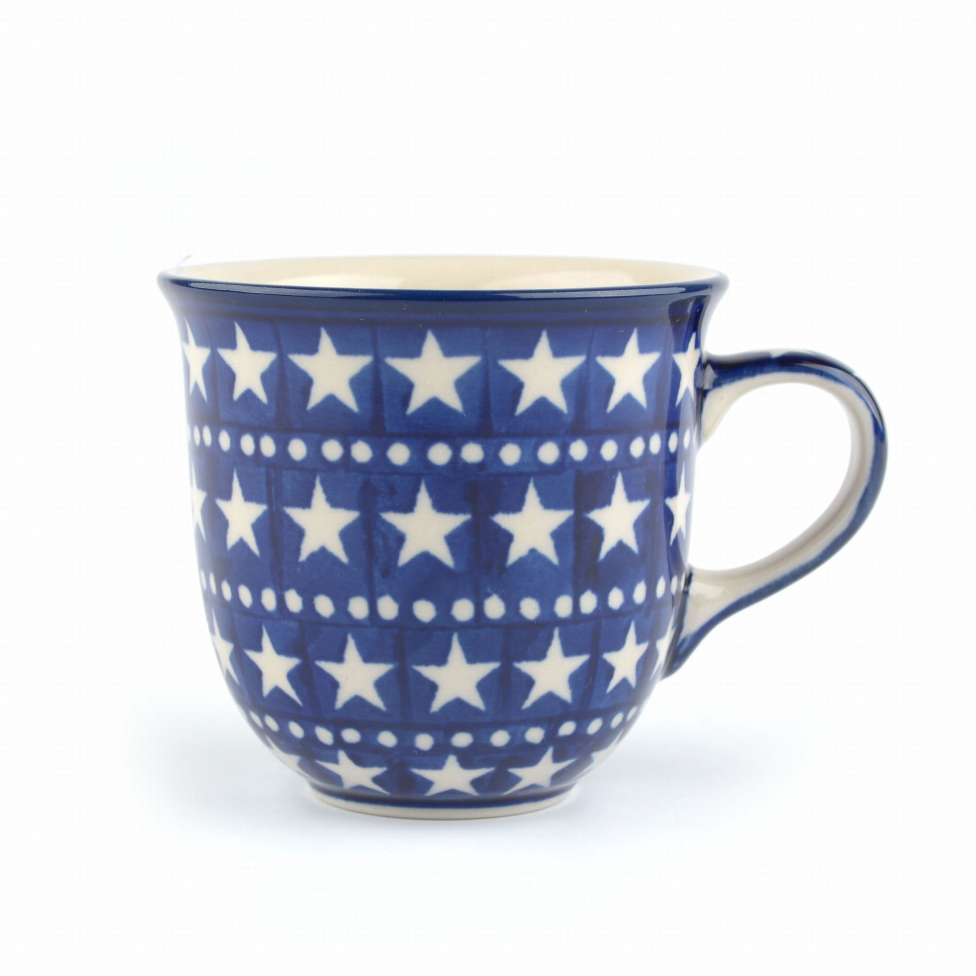 Blauw-witte keramische mok met sterrenpatroon en gebogen handvat.
