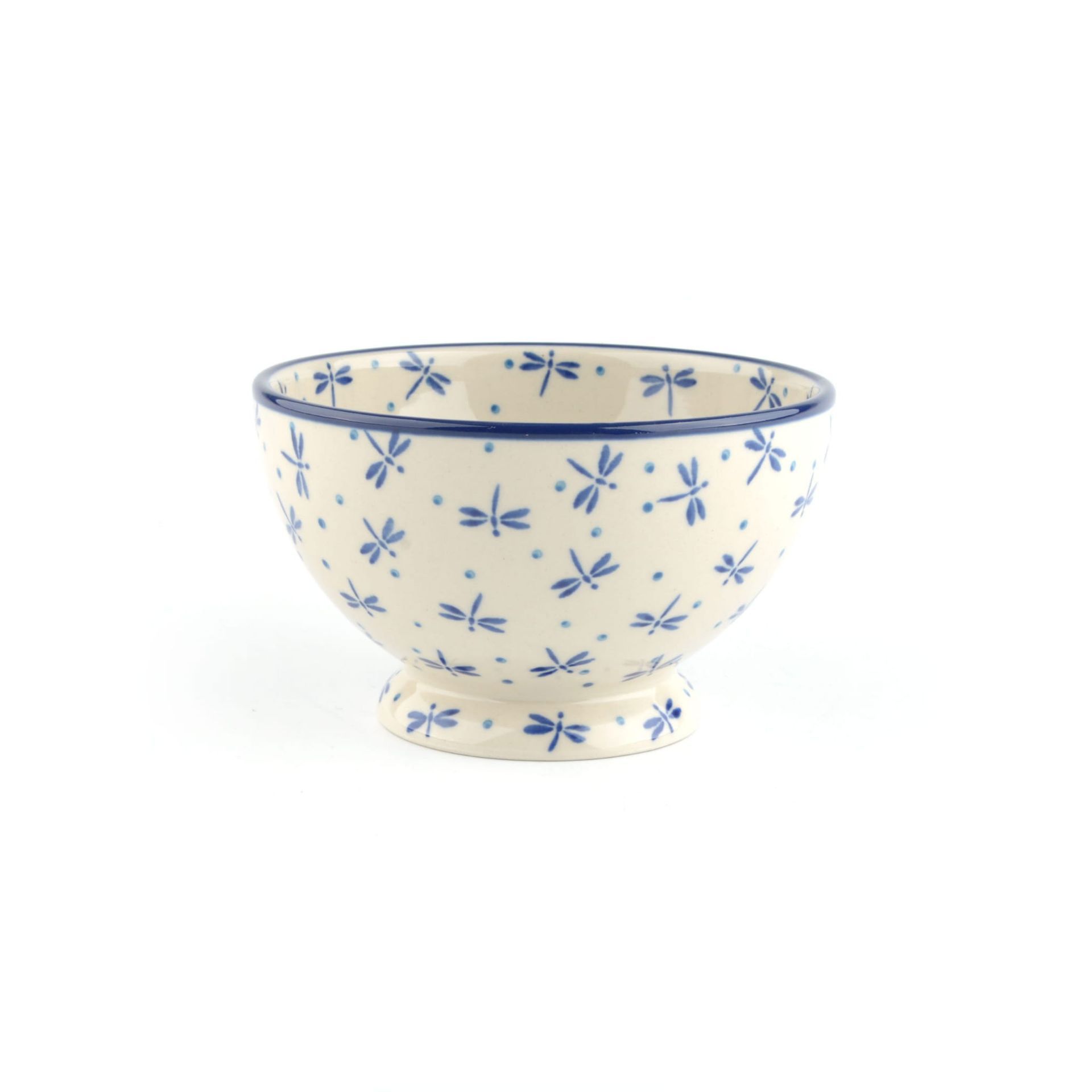 Witte keramische kom met een blauw libellenpatroon en een blauwe rand.