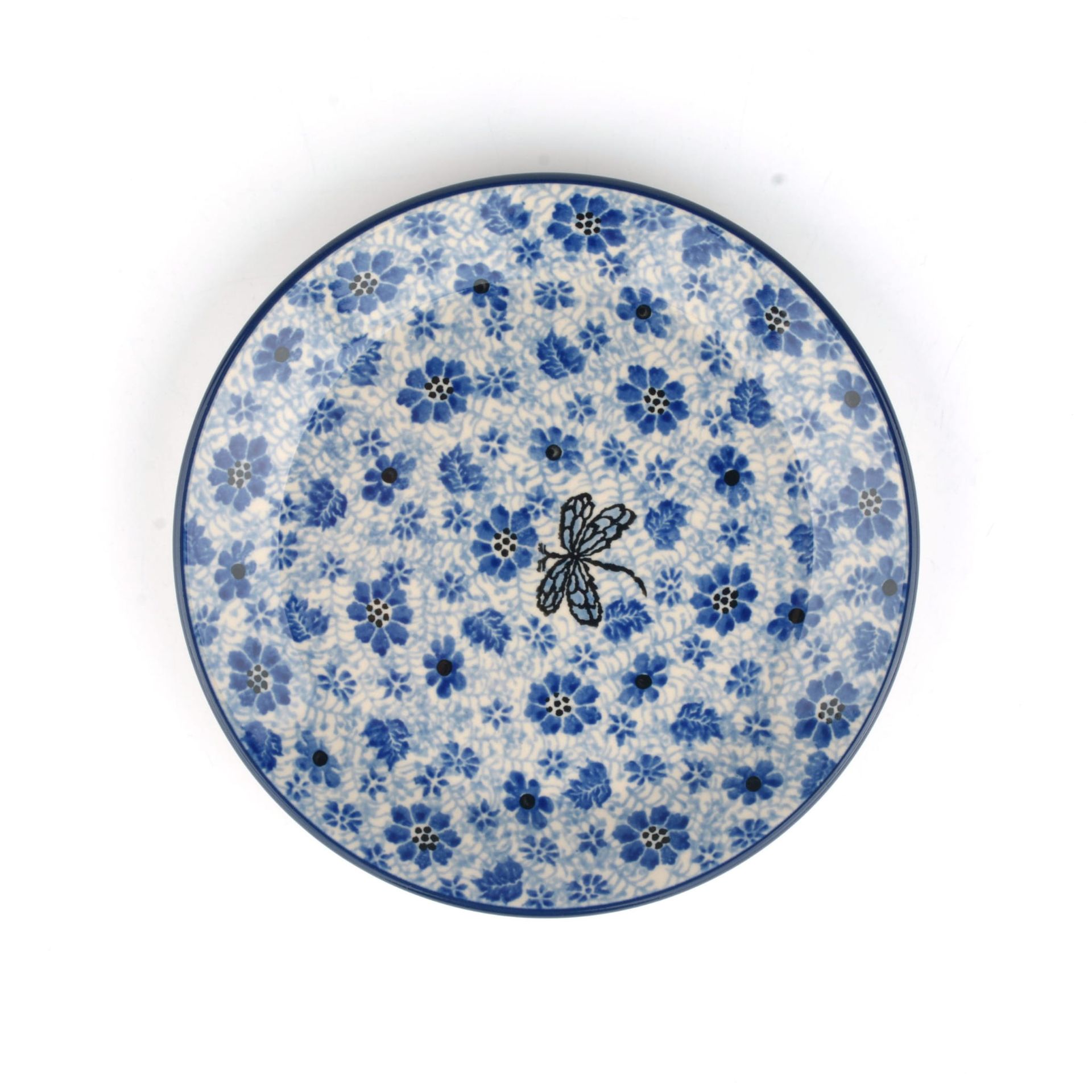 Blauw keramisch bord met bloemenpatroon en een libelle in het midden.