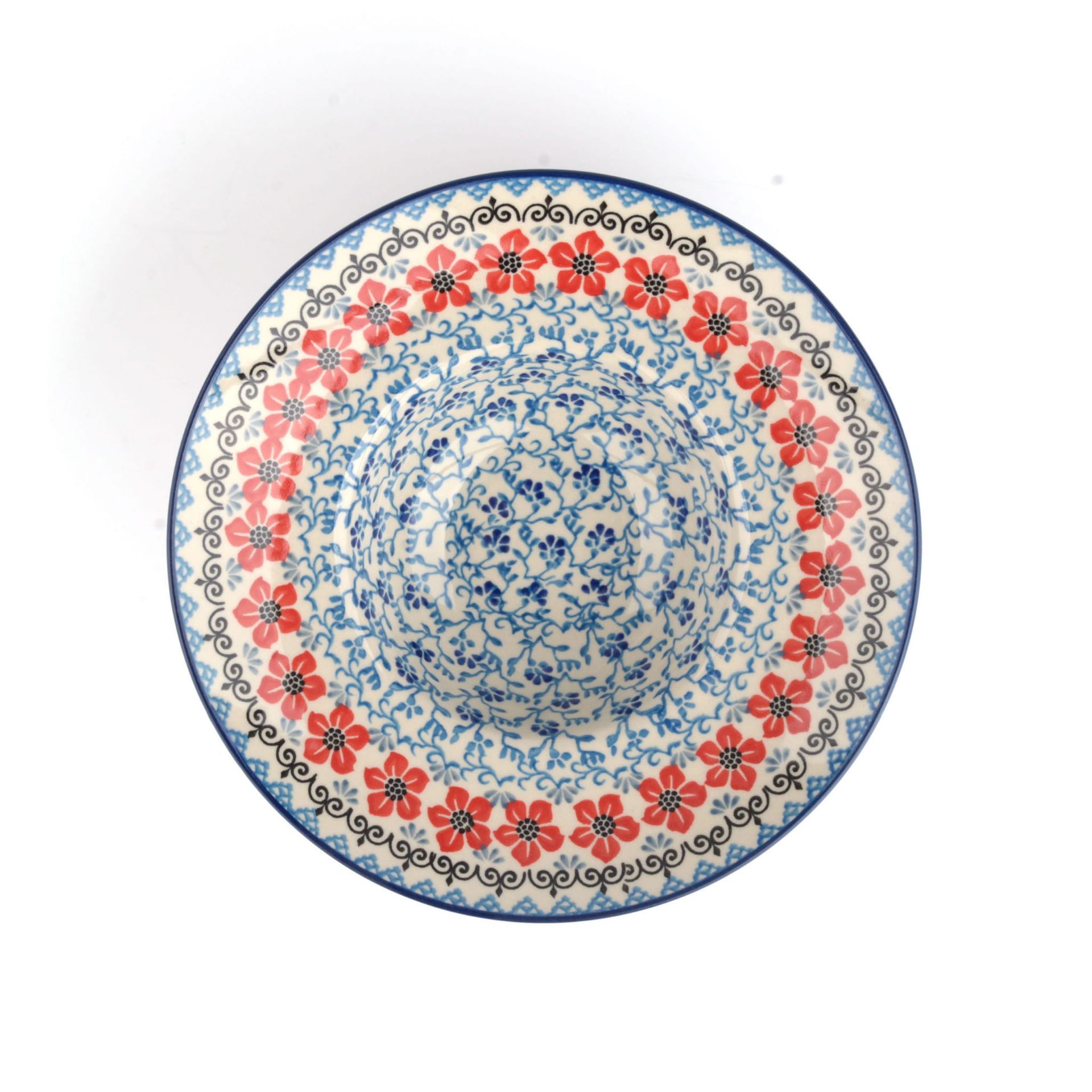 Blauwe en witte keramische kom met rood bloemenpatroon.