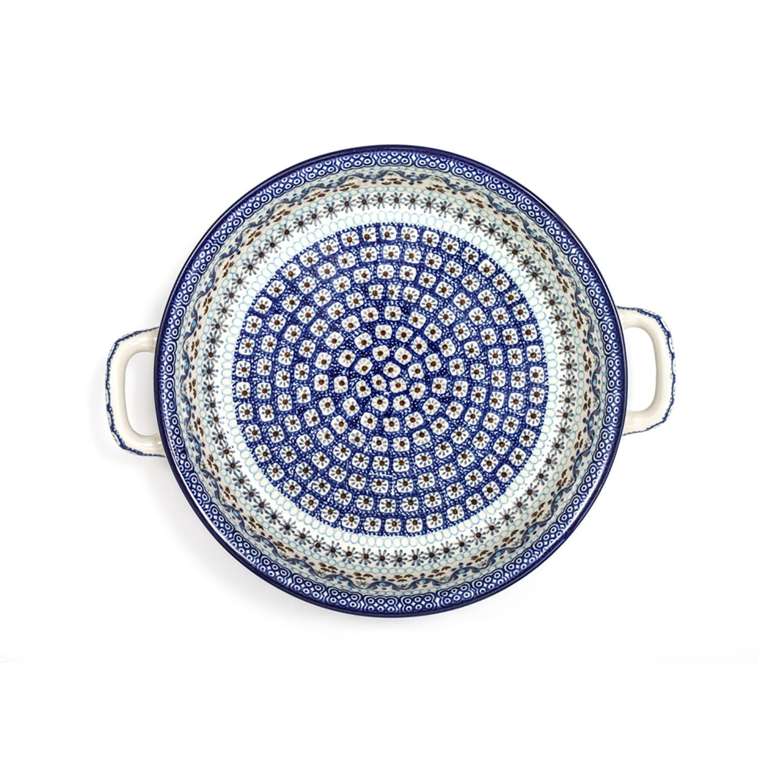 Blauw-witte keramische ovenschaal met decoratief bloemen- en vogelmotief en witte handvatten.