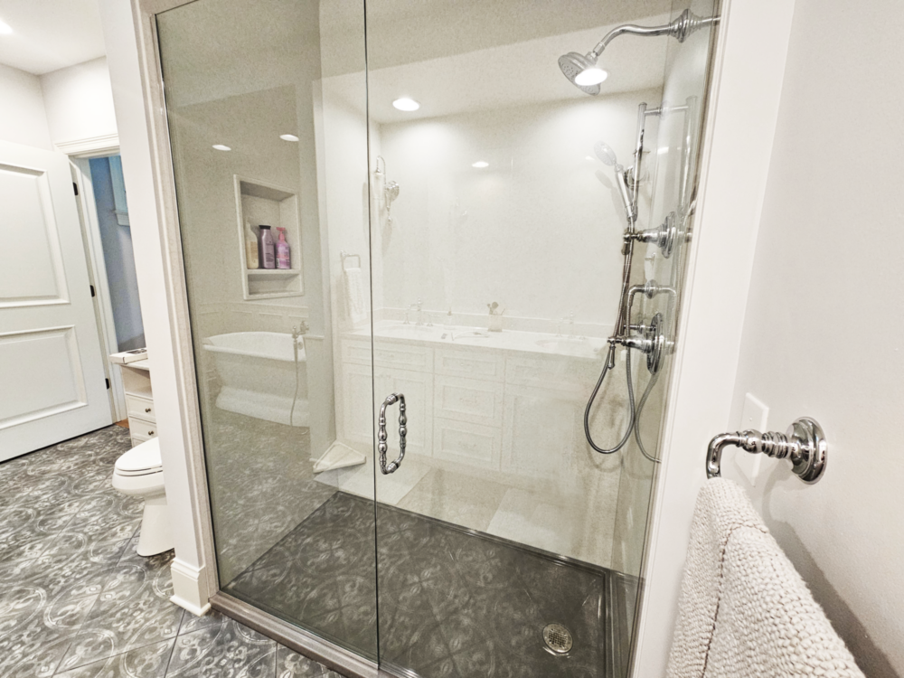 Tresor Door and Panel Shower Enclosure featuring Clear Glass and Chrome Hardware