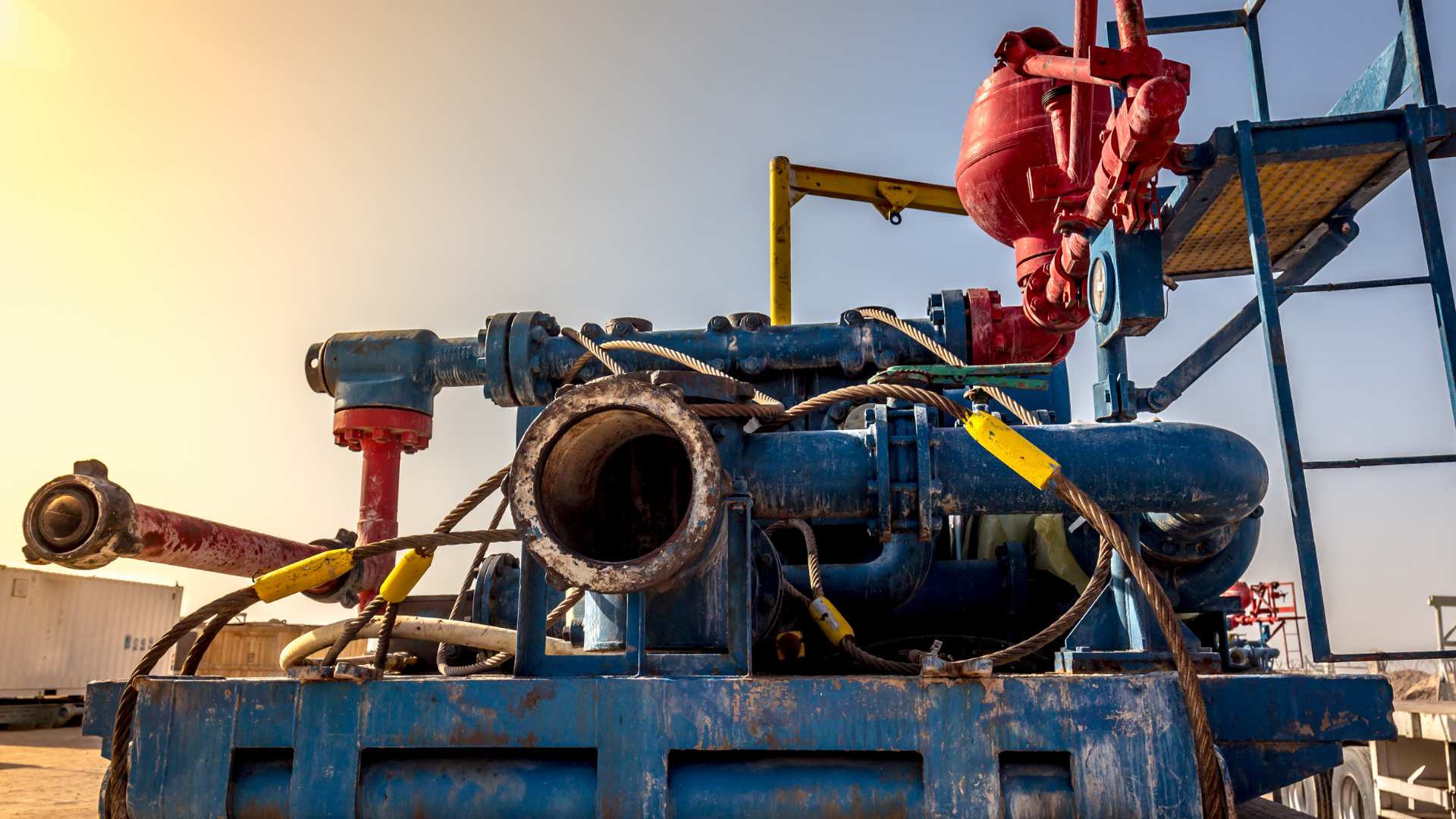 A large blue machine with a lot of pipes attached to it.