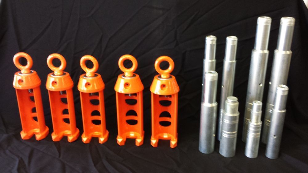 A row of orange and silver objects on a black cloth