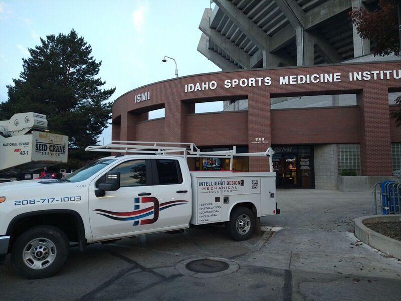 White utility truck parked outside Idaho Sports Medicine Institute building