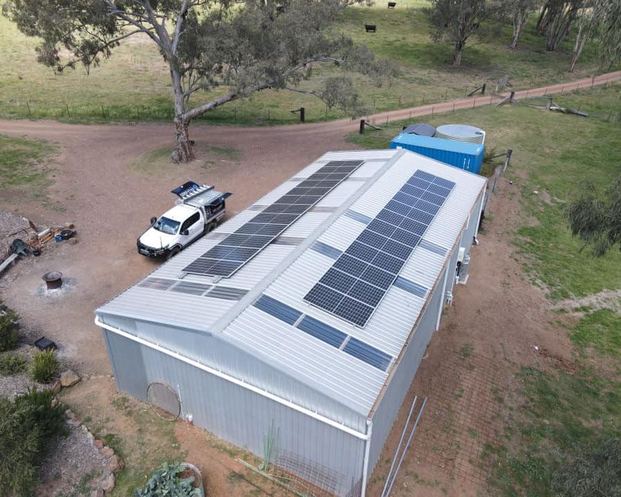 An Aerial View Of A Building With Solar Panels On The Roof — Experienced Solar Installers in Tamworth