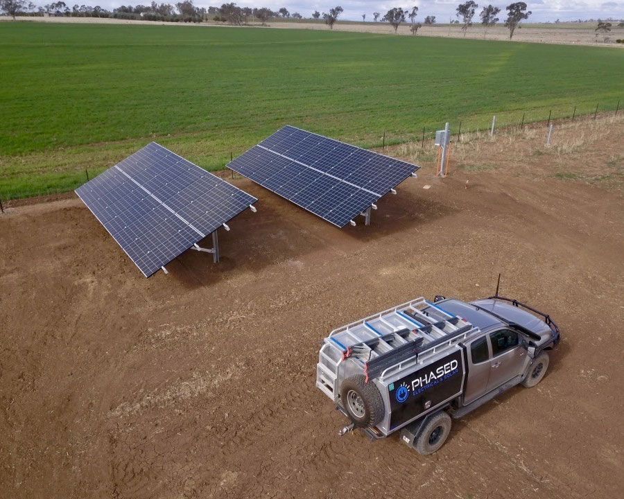 Aerial View Of Solar Panels And A Phased Truck — Experienced Solar Installers in Tamworth