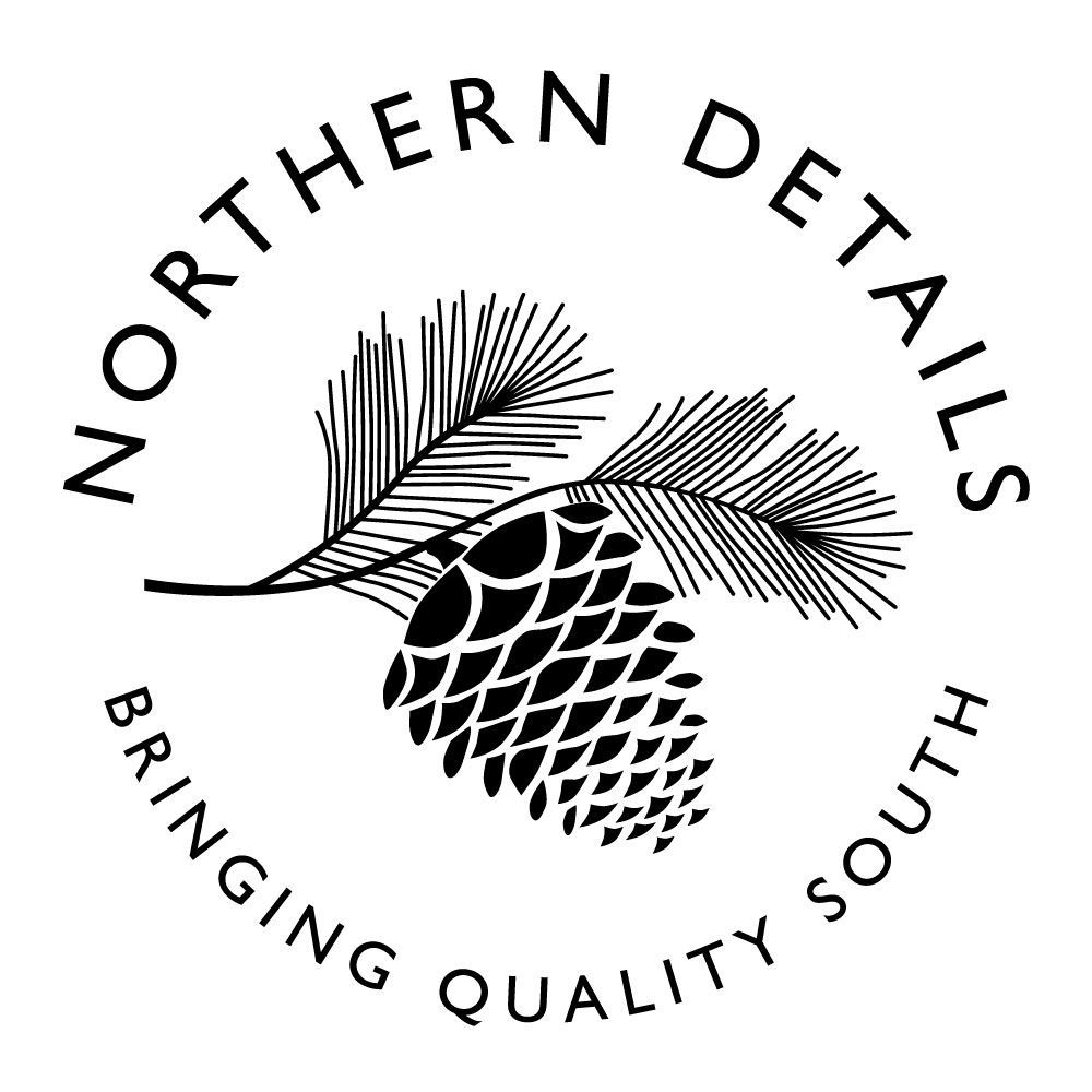 A black and white circular logo with a pinecone and needles in the center, captioned 