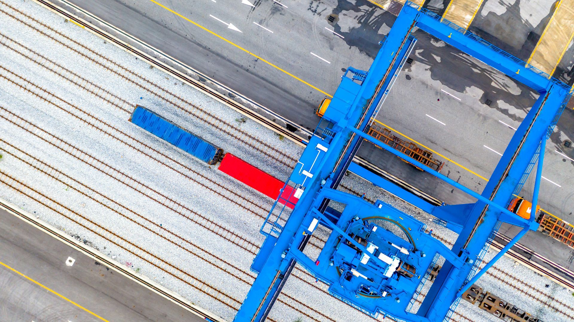 Aerial view of railway tracks with construction equipment