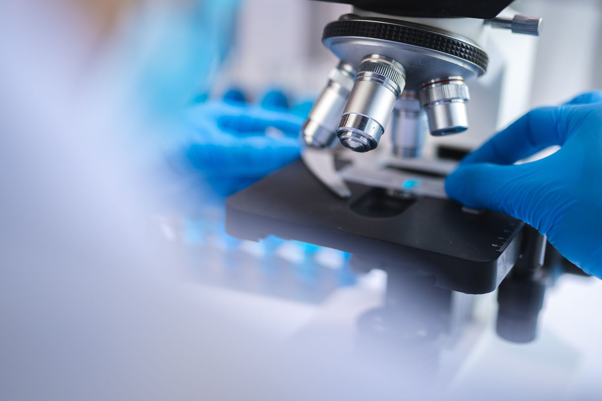 Scientist using a microscope in a laboratory