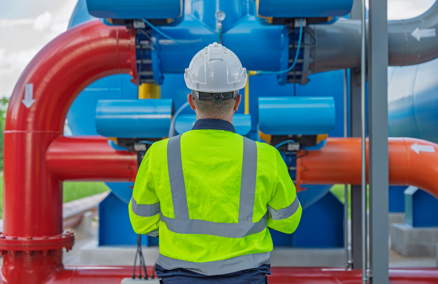 Water engineer inspecting treatment plant infrastructure