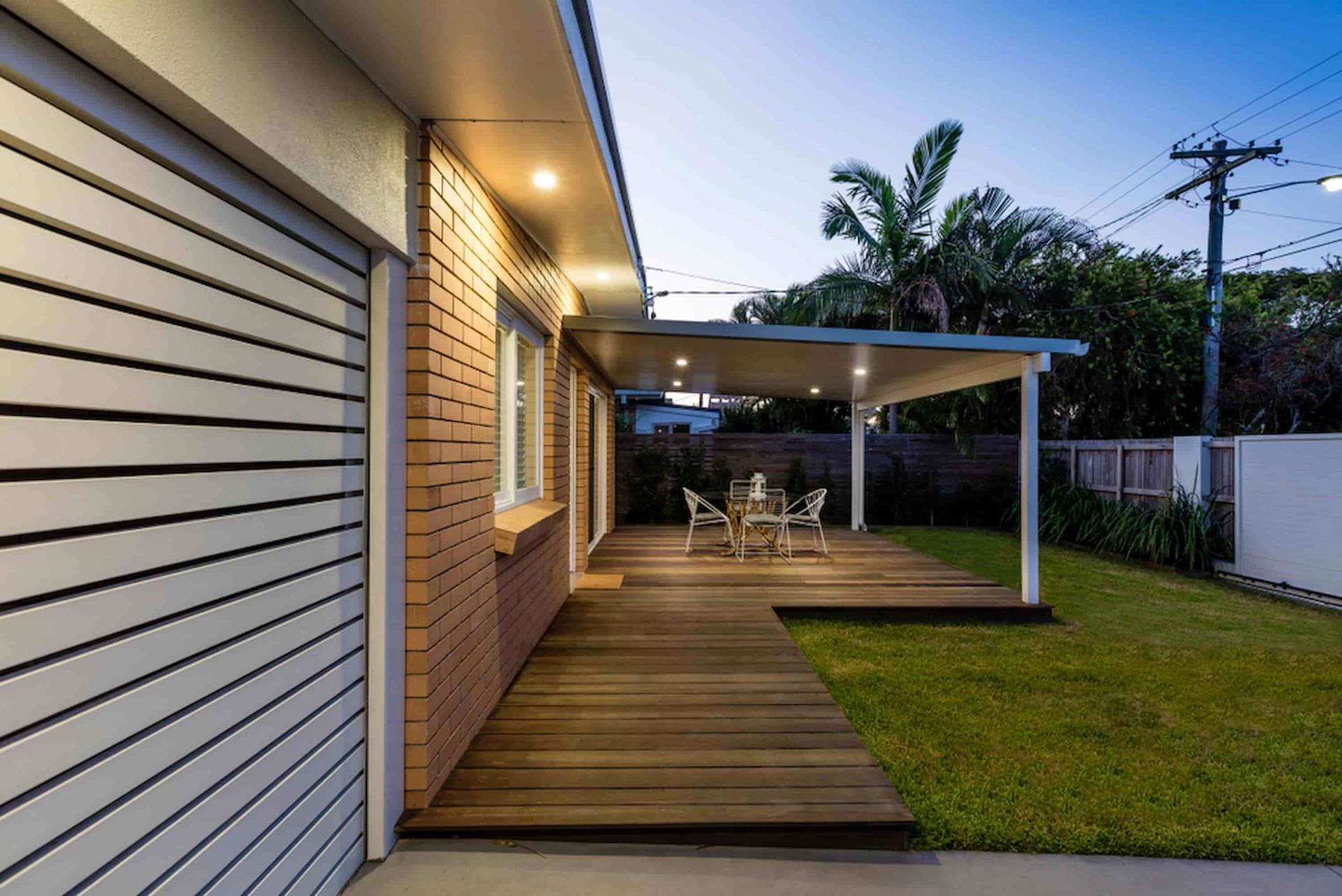 A House with A Wooden Deck and A Table and Chairs on It — Budget Timbers in Tweed Heads, NSW