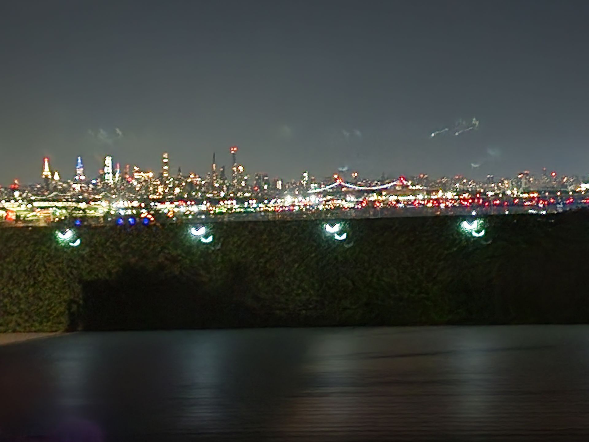 A blurry picture of a city skyline at night