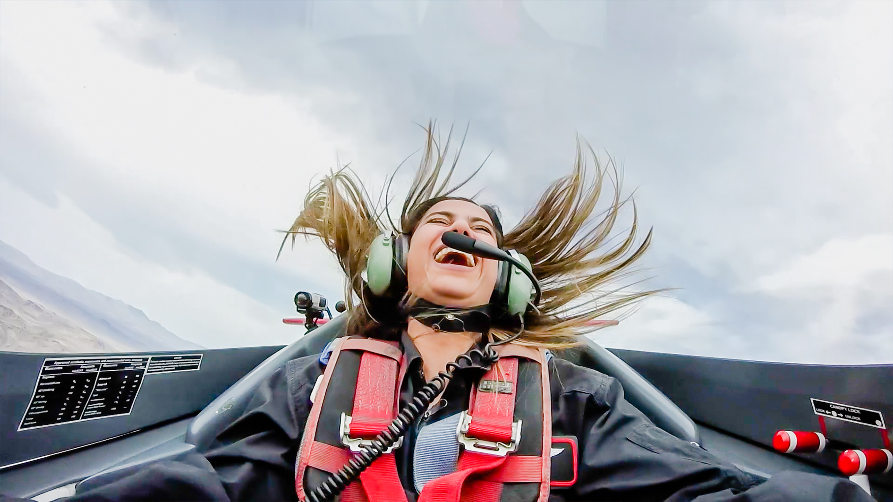 Guest laughing in the cockpit mid-aerobatics