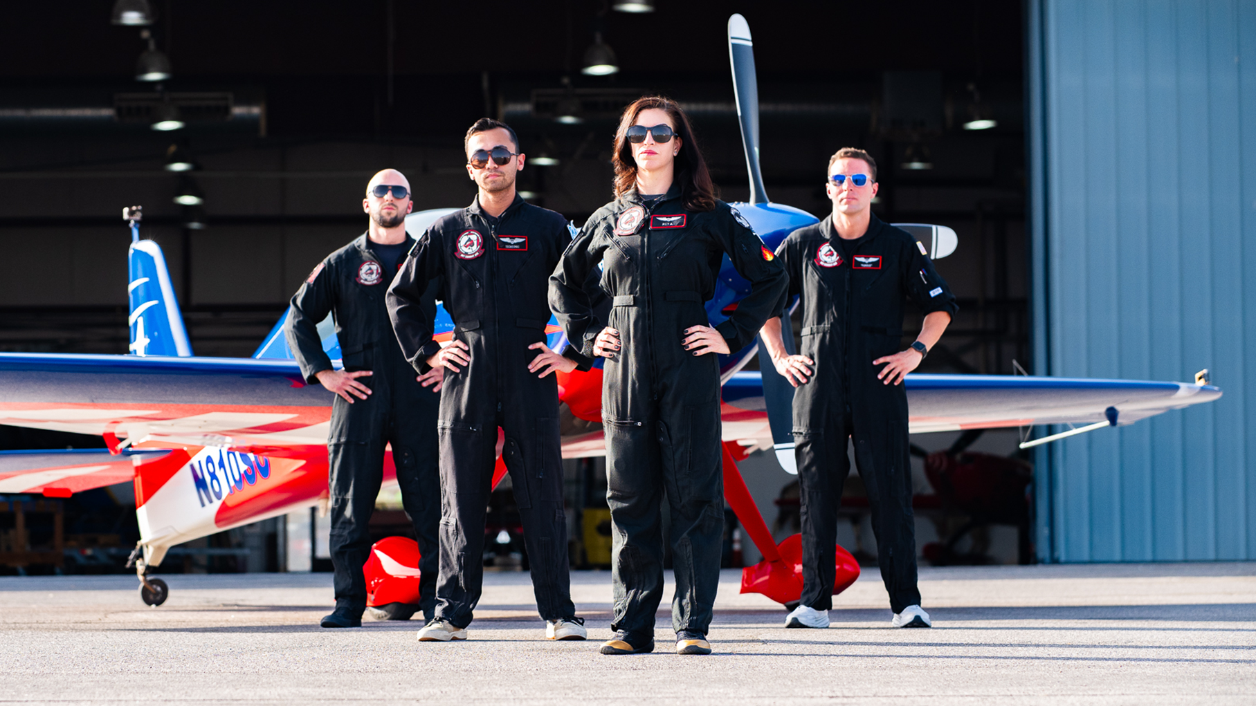 Sky Combat Ace pilots in front of the hangar
