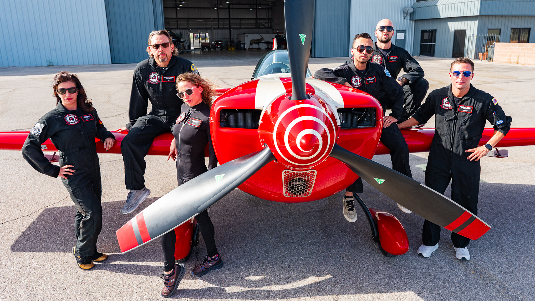 The Sky Combat Ace pilot team around an aircraft