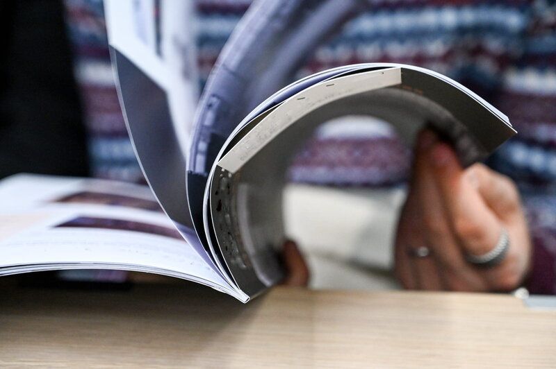aviation lover reading through aviation magazine
