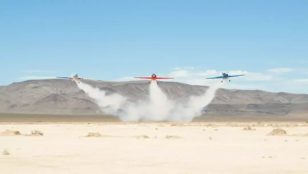 Aerobatic planes completing stunt