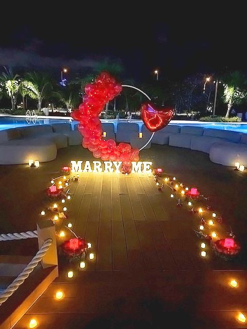 Pool side at the Hard Rock included a candle lit path way filled with roses, marquee letters that read Marry Me.