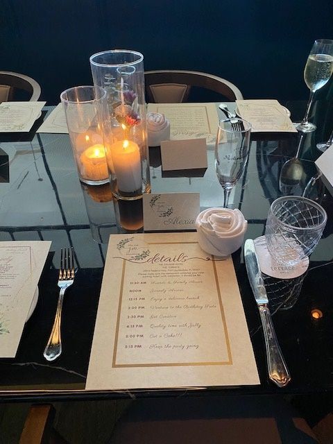 Brunch Placesetting created by An Elegant Picnic with a napkin folded into a rose