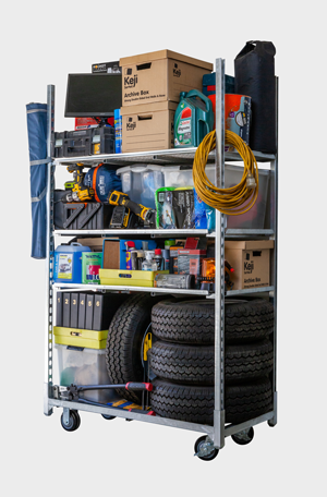 A cart filled with lots of boxes , tires , and other items.
