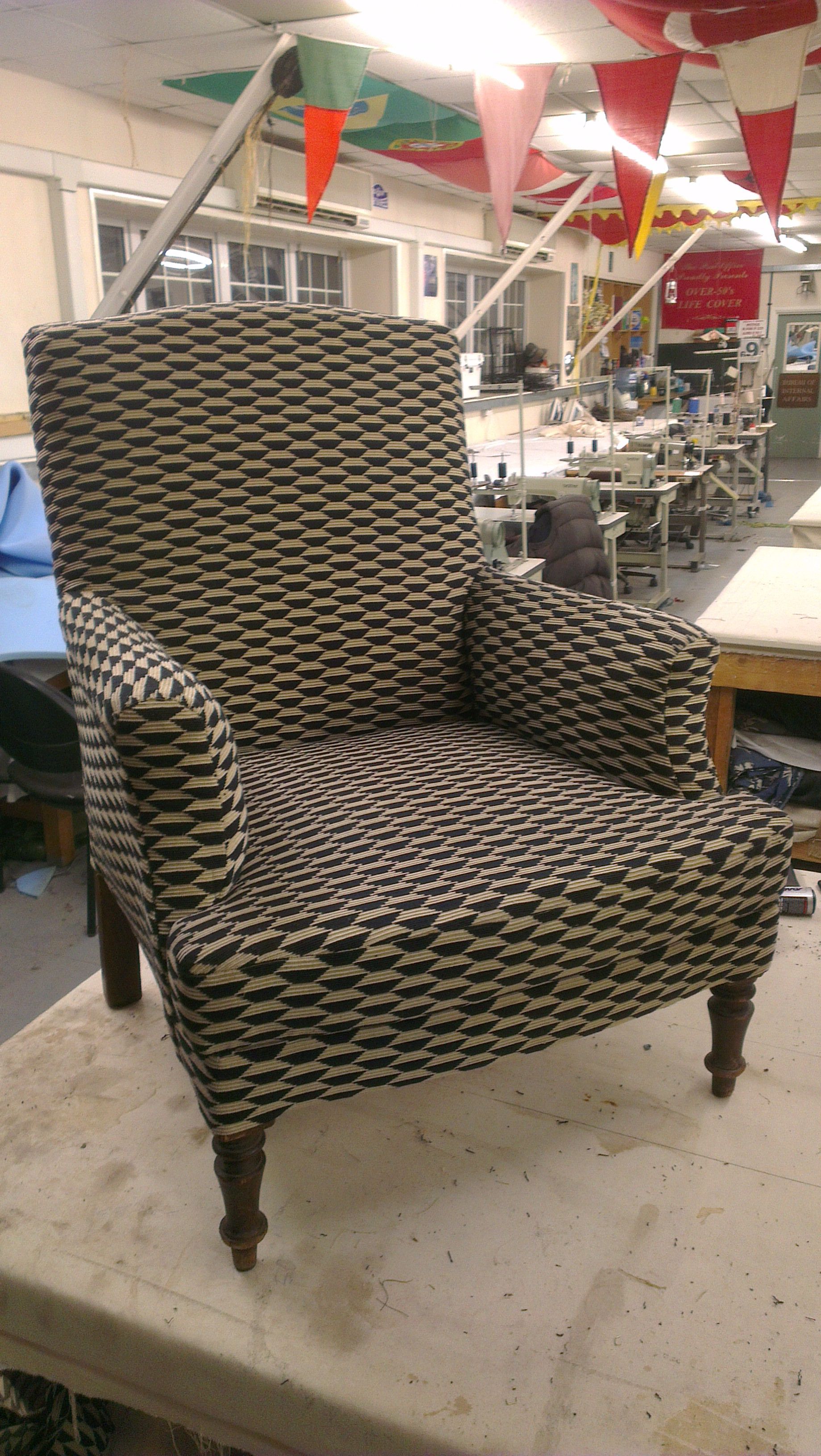 Wing back chair with black and white fabric.