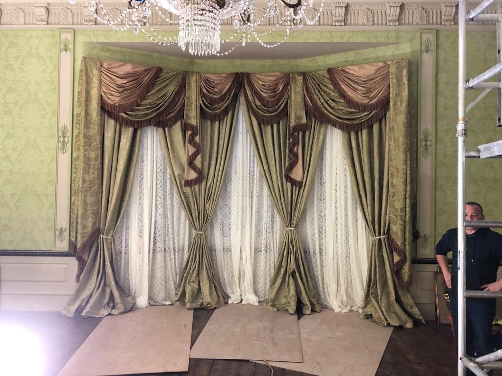 An ornate set of unusual regency style curtains for