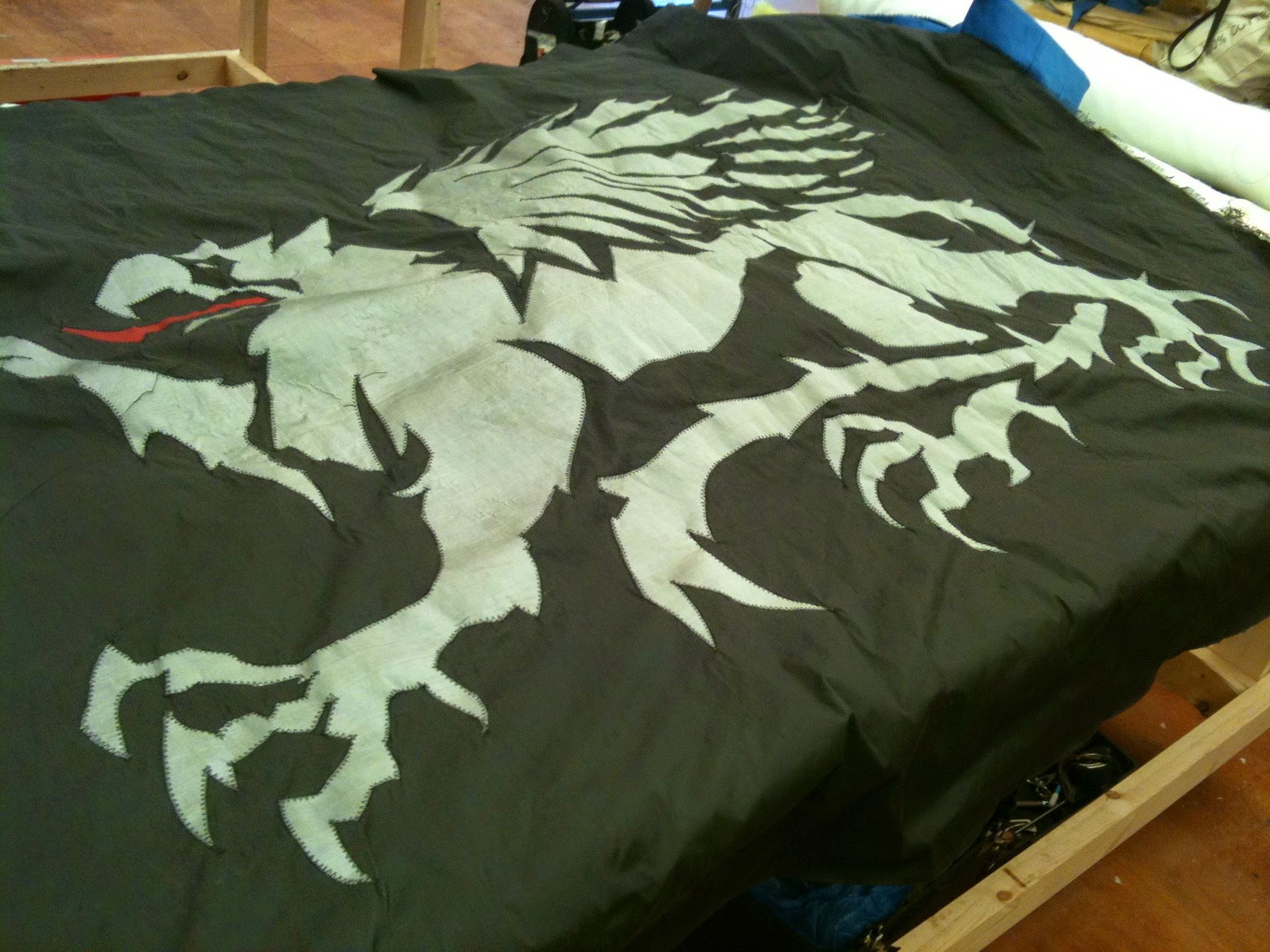 A black flag with sewn on stylised griffin motif. From the film