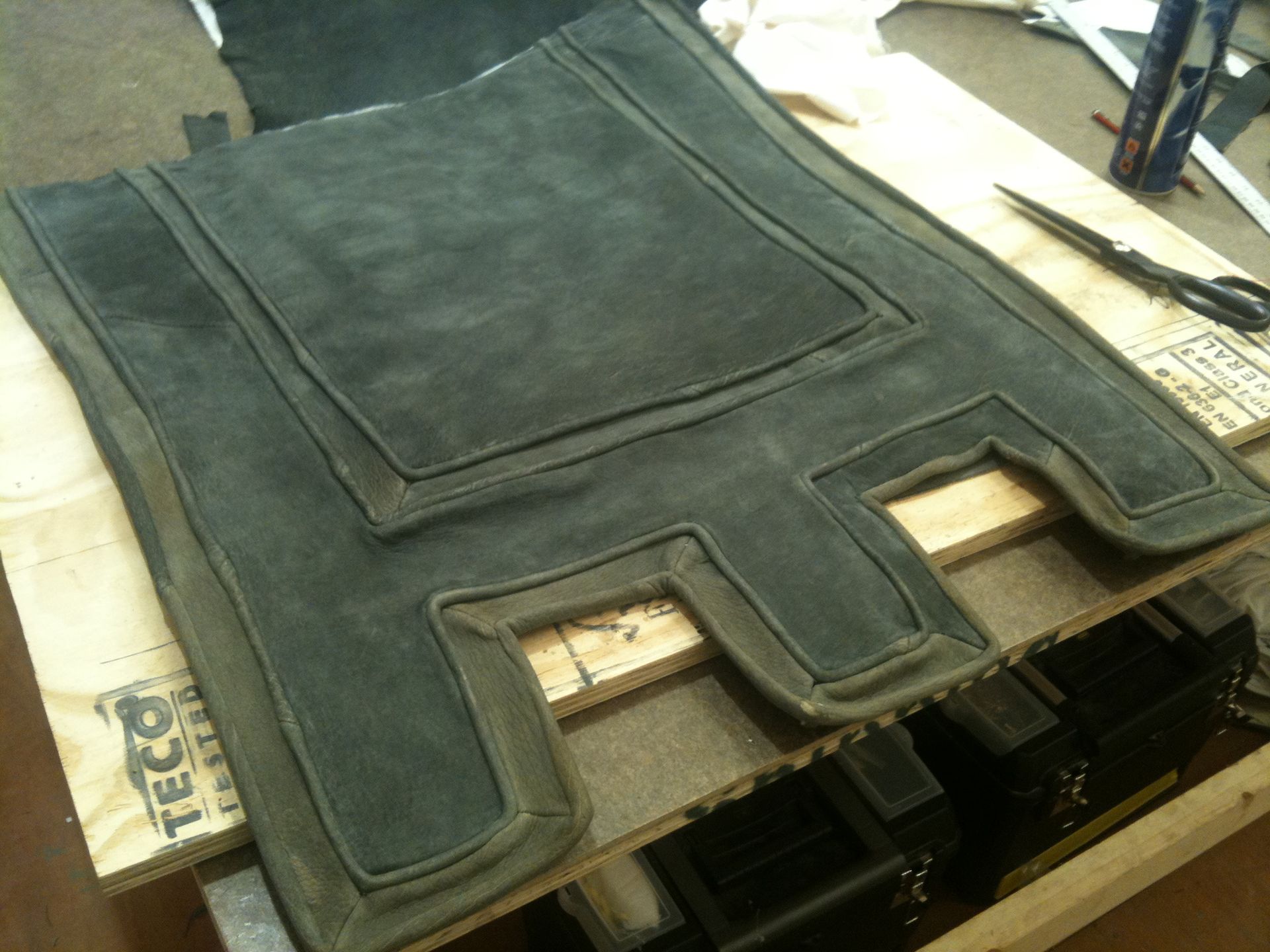 A castellated horse blanket made from leather from